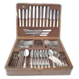 A complete stainless steel cutlery set for six place settings, some marked "Battle Axe" in fitted