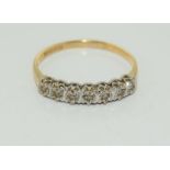 A 9ct gold ladies seven stone 1/2 eternity ring, Size O.