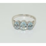 9ct gold ladies 3 stone aquamarine ring. Size Q.