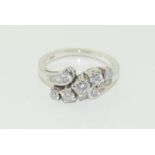 A 15ct white gold diamond sweep ring, Approx 1ct.