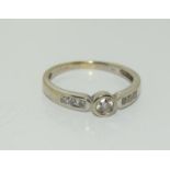 An 18ct gold ladies diamond shoulder ring approx 0.25ct, size L.