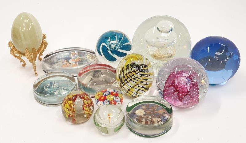 A collection of glass paperweights to include Caithness millefori and imperial.