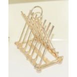An interesting silver plated toast rack in the form of golf clubs.