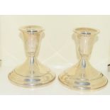 Pair of silver dwarf candlesticks.