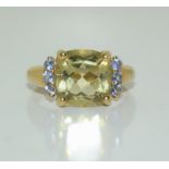 A 9ct gold peridot ring Size M.