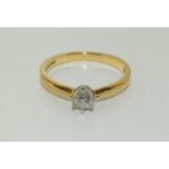 An 18ct gold ladies diamond and solitaire ring approx 0.25ct, Size N.