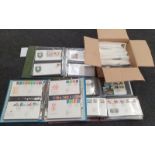 A large collection of worldwide first day covers in a quantity of stamp albums.