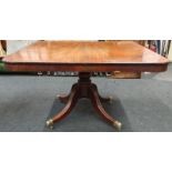 A mahogany tip top breakfast table on brass castors together with four button back for dining chairs