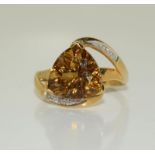 A 9ct gold diamond and amber Quartz ring, Size N