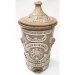 An antique porcelain water filter with lid by "F.Hatkins & Co, 62 Fleet Street, London"