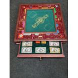 Franklin Mint Monopoly collector's edition board game in solid wooden cabinet.