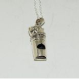 A silver whistle on chain in the form of a fist.