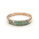 9ct gold emerald and diamond 1/2 eternity ring. Size P.