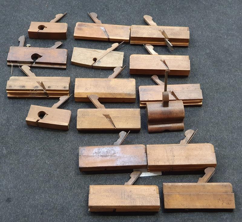 A collection of wooden woodworkers shaping planes.