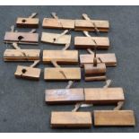 A collection of wooden woodworkers shaping planes.