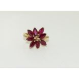 9ct gold ladies ruby cluster ring. Size N+.