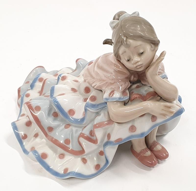 Lladro Model 5389 Deep in Thought flamingo girl in polka dot frock.