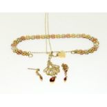 A 9ct gold ladies pendant, earrings and a multi gold bracelet. 8.5gm