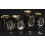 A collection of four boxed glasses by Impitoyable.