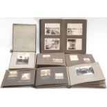 Collection of albums containing early black and white photographs.