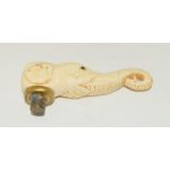 An unusual bone walking cane handle in the form of an elephant.