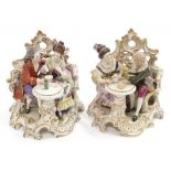 Pair of porcelain figures in romantic settings showing possibly Derby back marks.