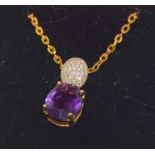 A silver CZ and amethyst pendant necklace.