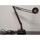An antique industrial Anglepoise style lamp with solid base.
