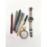 Mixed bag of watches and pens.
