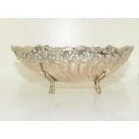 Silver H/M four legged bowl with impressed decoration. 140g.