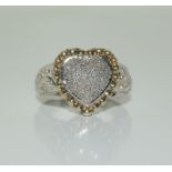 A heart shaped diamond cluster ring, Size N.