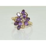 A 9ct ladies amethyst and diamond ring.