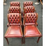 Set of six bentwood Chesterfield style dining chairs in red leather to include two carvers.