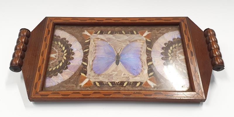 A twin handled mahogany inlaid breakfast tray with butterfly wing decoration to centre.