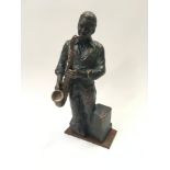 Figure of a saxophone player.