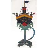 Decorative metal rocking ship ornament.