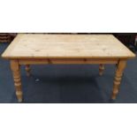 Rectangular solid pine dining table. 167x90cm.