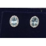 A pair of 18ct white gold aquamarine and diamond stud earrings of approx 85 points.
