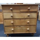 Victorian two over three pine chest of drawers on tapered feet.