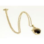 A 9ct gold tiger eye watch fob on 9ct gold chain. 14.75gm total