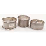 Three silver engine turned napkin rings. 70gm