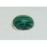 A silver malachite brooch.