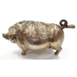 A vintage solid brass wind up bell in the form of a pig.