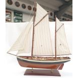 Model of a sailing barge on stand.