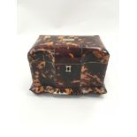 Tortoiseshell tea caddy.