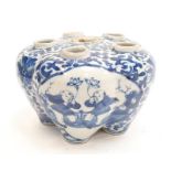 Oriental blue white 6 hole insence stand with Mark's to the base.