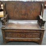 A vintage Monks bench with under seat storage.