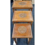 Nest of three Chinese hardwood tables.