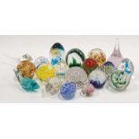 A collection of 19 assorted glass paperweights.