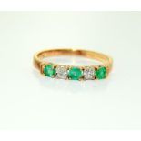 9 carat gold ladies emerald and diamond band ring. Size N.